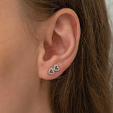 Boucles d'oreilles pour femme en argent avec deux cœurs cloutés